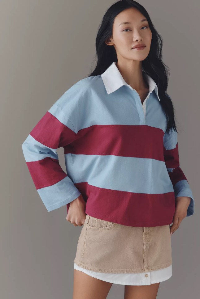 Female wears striped rugby style top