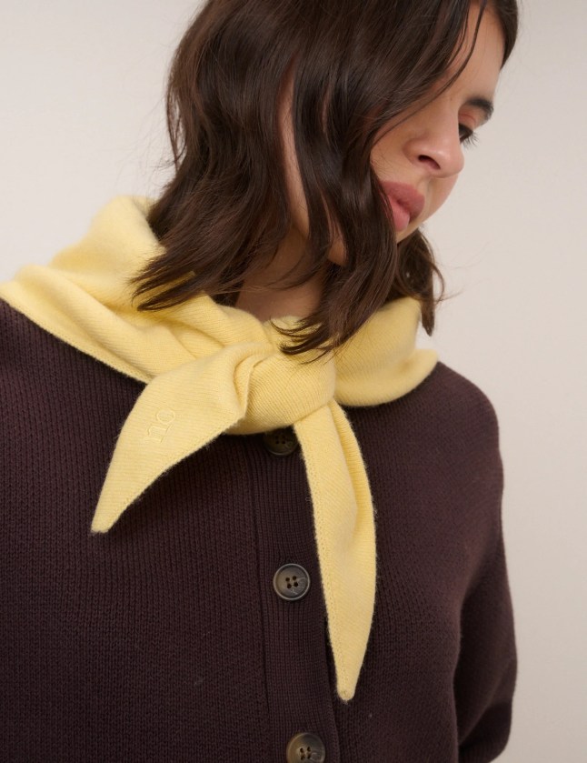 Female wears yellow scarf