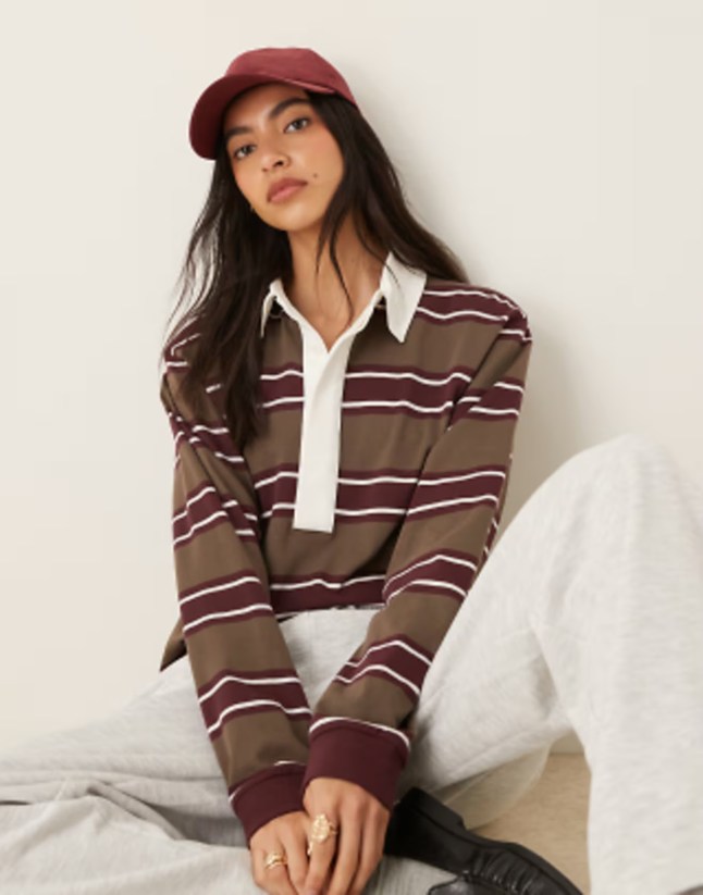 Female wears striped rugby style top