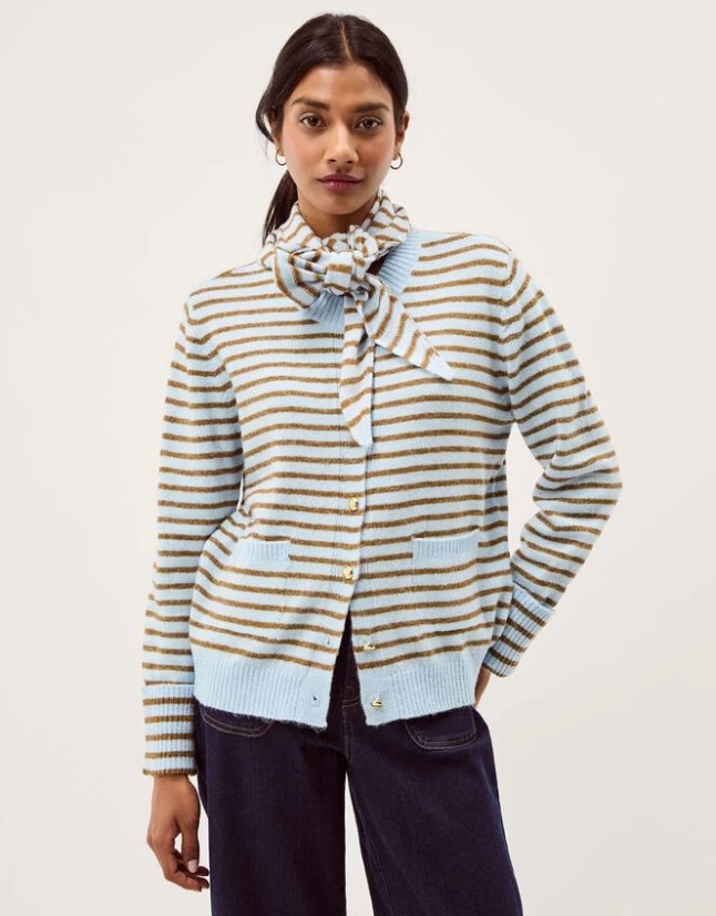 Female wears stripe cardigan with matching scarf around the neck