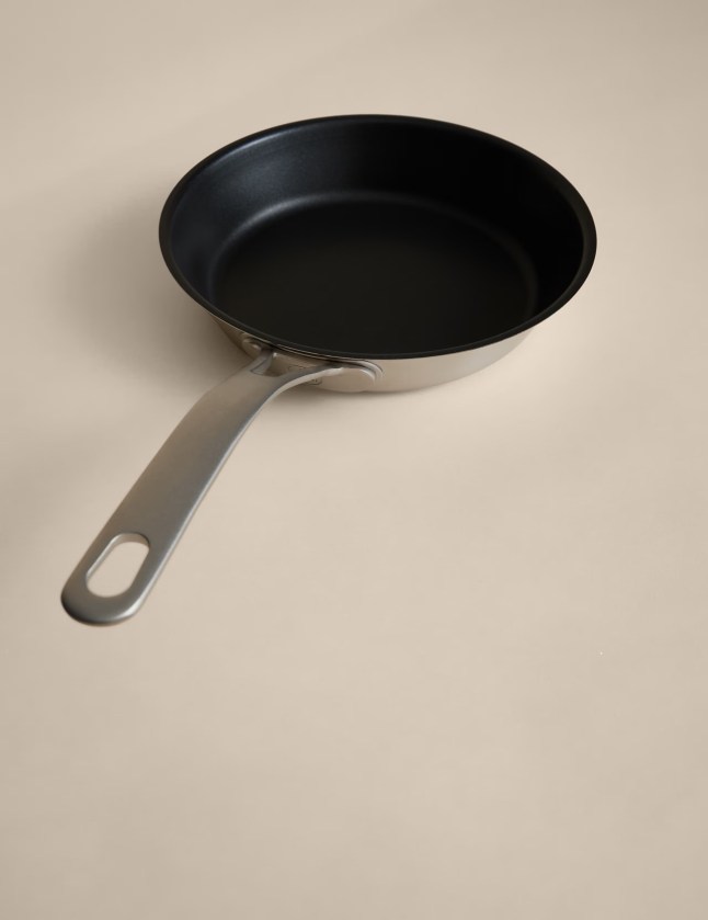 Stainless steel pan with black insides