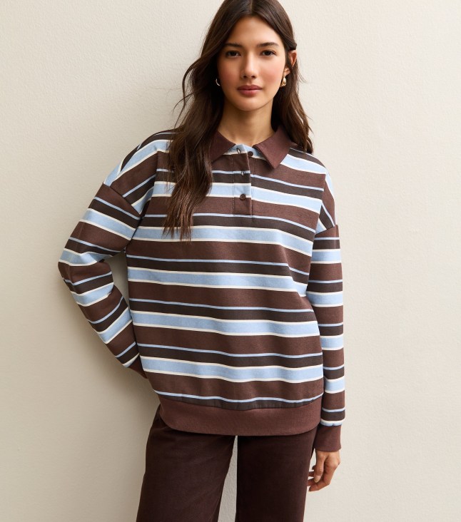 Female wears striped rugby style top
