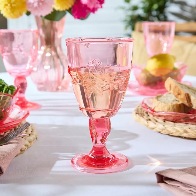 Pink plastic glass with design