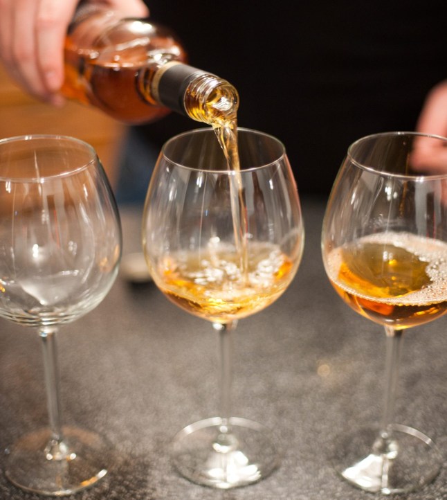 Mead being poured into wine glasses