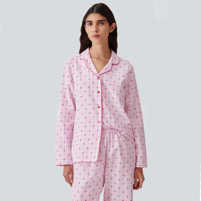 Female wears pink pjs with pattern