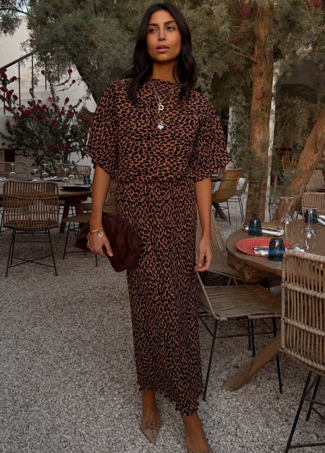 Female wears leopard printed dress