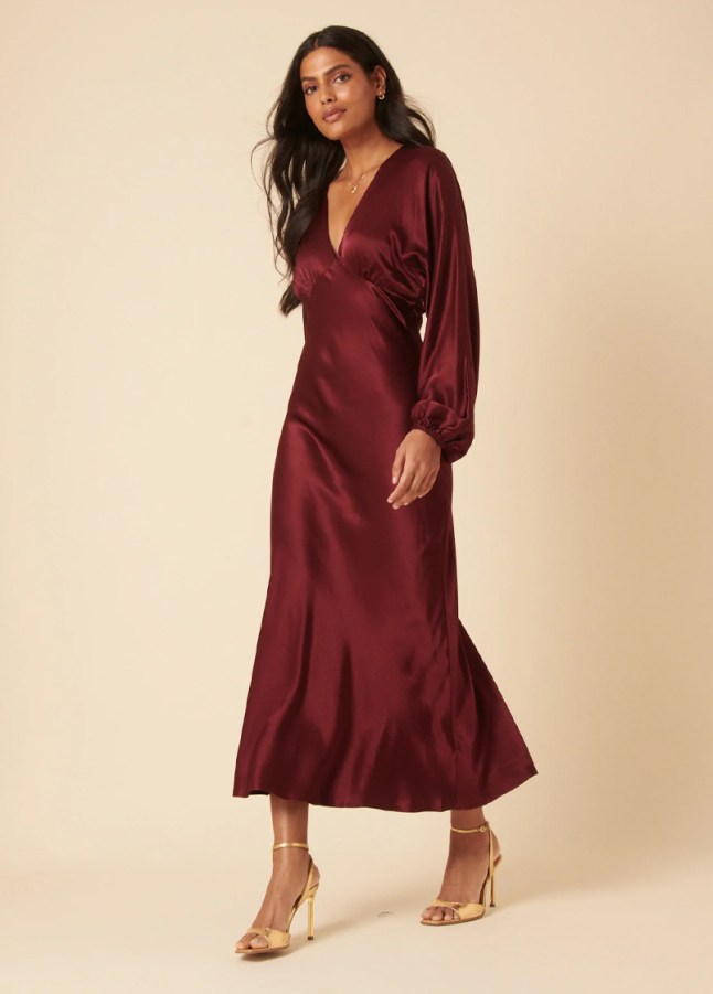 Female wears burgundy dress