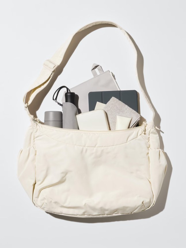 Large white bag with items poking out of the top