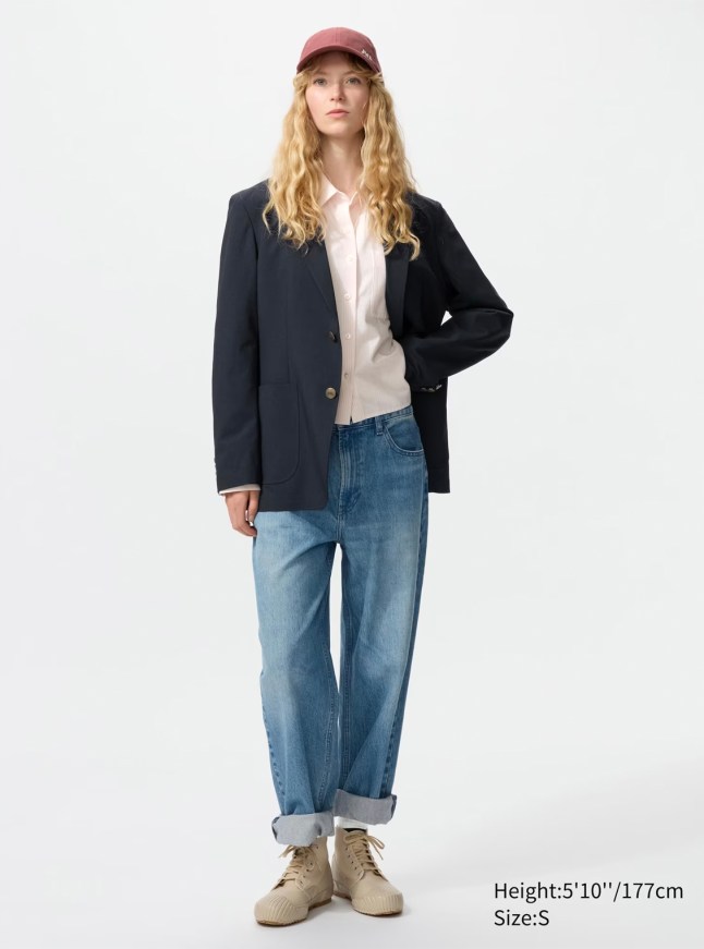 Female wears navy blazer with white t-shirt and jeans