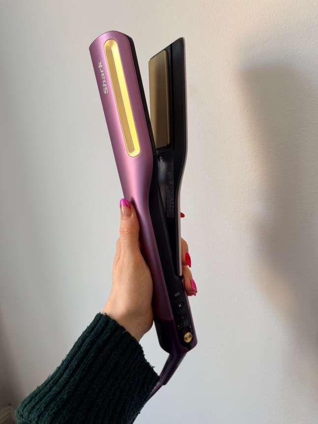 Purple hair tool in female's hand