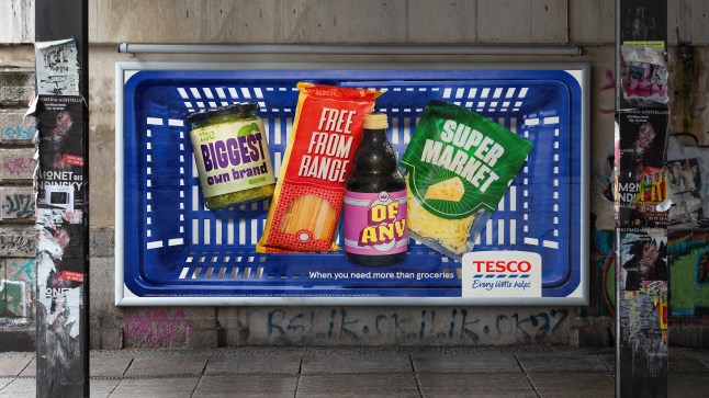 Tesco advert showing a basket with groceries and new slogan on a wall